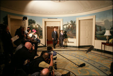 President George W. Bush, with Mrs. Laura Bush by his side, comments on the formation of the new govenment in Iraq, Sunday, May 21, 2006 in the Diplomatic Reception Room of The White House.