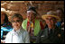 Mrs. Laura Bush and Mesa Verde National Park Superintendent Larry Wiese share a laugh, Thursday, May 23, 2006, during the celebration of the 100th anniversary of Mesa Verde and the Antiquities Act in Mesa Verde, Colorado. Also pictured are members of the Ute Mountain Ute Tribe.
