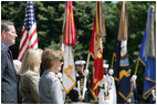 Mrs. Bush stands with Health and Human Services Secretary Mike Leavitt during a Memorial Day wreath laying ceremony at the Tomb of the Unknowns in Arlington National Cemetery in Arlington, Va., Monday, May 29, 2006.