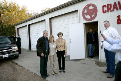President George W. Bush and Laura Bush greet fellow voters after casting their ballots at the Crawford Fire Station in Crawford, Texas, Tuesday, Nov. 7, 2006. 