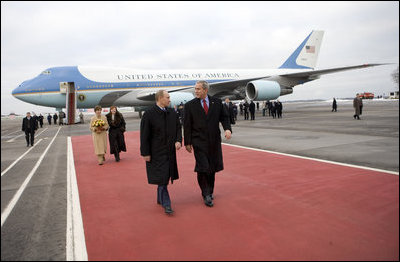 President George W. Bush and Laura Bush walk the red carpet with Russia's President Vladimir Putin and Lyudmila Putina after their arrival Wednesday, Nov. 15, 2006, at Vnukovo Airport in Moscow.