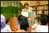 Mrs. Laura Bush reads Miss Spider's Tea Party during her visit Thursday, Nov. 16, 2006, to the National Library Building's Children's Reading Room in Singapore. Afterward, Mrs. Bush participated in a brief question-and-answer session with the kids. 