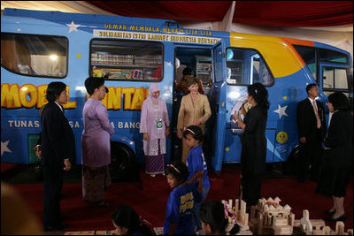 Mrs. Laura Bush tours a bookmobile Monday, Nov. 20, 2006, with Mrs. Ani Yudhoyono, wife of Indonesia's President Susilo Bambang Yudhoyono, during a six-hour visit to Bogor, Indonesia.