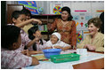 Mrs. Laura Bush talks with students at Papandaya Public Elementary School in Bogor Palace, Indonesia, Monday, Nov. 20, 2006.