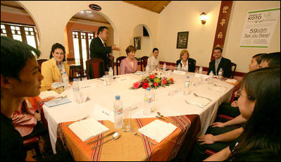 Mrs. Laura Bush is welcomed on November 17, 2006, to a roundtable and lunch at the KOTO Restaurant in Hanoi by Jimmy Pham, Founder and Project Director of Know One, Teach One, a grass-roots humanitarian program designed to train Hanoi youth in the service industry. 