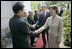 Mrs. Laura Bush is greeted as she and President George W. Bush arrive for church services Sunday, Nov. 19, 2006, at Cua Bac Church in Hanoi.
