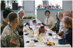 Mrs. Laura Bush is joined by Mary Fallon, left, wife of Navy Admiral William J. Fallon the Commander of the U.S. Pacific Command, during breakfast with military personnel Tuesday, Nov. 21, 2006, at the Officers Club at Hickam Air Force Base in Honolulu, Hawaii.