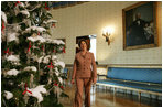 Mrs. Laura Bush presents the White House Christmas Tree to the press in the Blue Room Thursday, Nov. 30, 2006. The tree is an 18-foot, 6-inch Douglas fir and was presented by Francis and Margaret Botek and their children, of the Crystal Spring Tree Farm in Lehighton, Pa.