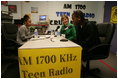 Mrs. Laura Bush participates in a radio interview with Amber Bellamy, age 17, left, and Elliott White, Jr., age 22, Wednesday, October 4, 2006, during a visit to the Children's Training Network/AM 1700 Radio Program in Buffalo, New York, as part of the President's Helping America's Youth initiative. Together with Crucial Human Service Center and other Buffalo community programs, AM 1700 Station encourages caring adults to connect as mentors with high-risk youth.