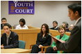 Laura Bush: Helping America's Youth (HAY) Visit to Colonie Youth Court. Latham, New York. Mock trial. As part of the President's Helping America's Youth initiative, Mrs. Laura Bush observes a mock trial at the Colonie Youth Court in Latham, New York, Wednesday, October 4, 2006. The Colonie Youth Court has been recognized by the U.S. Department of Justice as a national model of effective programming to help at-risk youth. The court has been replicated in more than 80 communities in the state of New York.