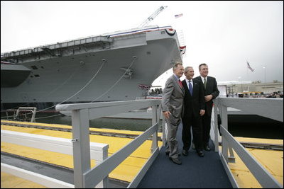 President George W. Bush, father President George H. W. Bush and brother Florida Governor Jeb Bush depart at the conclusion of the Christening Ceremony for the George H.W. Bush (CVN 77) in Newport News, Virginia, Saturday, Oct. 7, 2006.