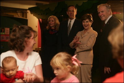 Mrs. Laura Bush waves to visitors during a tour of Cinergy Children's Museum in Cincinnati, Ohio, Wednesday, October 11, 2006. Ranked among the world's top 25 children museums, Cinergy Children's Museum offers more than 1,800 hours of programming for children in areas such as arts, culture, reading and science.