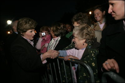 Mrs. Laura Bush greets members of the audience members that include representatives from breast cancer organizations, supporters of breast cancer research, breast cancer survivors and local residents during the Arch Lighting for Breast Cancer Awareness Thursday, Oct. 12, 2006, in St. Louis.