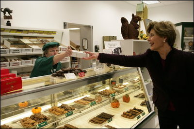 Mrs. Laura Bush purchases a box of homemade chocolates Tuesday, October 24, 2006, at Seroogy's, a family owned business that has been making chocolates for more than a hundred years in De Pere, Wisconsin.