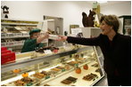 Mrs. Laura Bush purchases a box of homemade chocolates Tuesday, October 24, 2006, at Seroogy's, a family owned business that has been making chocolates for more than a hundred years in De Pere, Wisconsin.