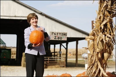 Mrs. Laura Bush picks out a pumpkin at Hackman's Farm Market and Green House Wednesday, October 25, 2006, in Columbus, Indiana.