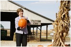 Mrs. Laura Bush picks out a pumpkin at Hackman's Farm Market and Green House Wednesday, October 25, 2006, in Columbus, Indiana.
