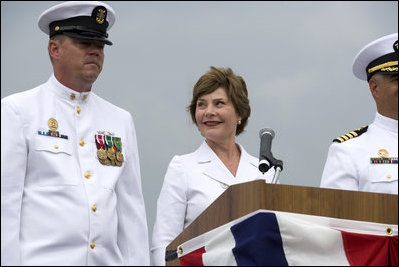 Mrs. Laura Bush smiles at Master Chief (SS) Mark K. Brooks, Command Master Chief, USS Texas, Saturday, September 9, 2006, after delivering remarks and giving the traditional command: "Man your ship and bring it to life!", during the Commissioning Ceremony in Galveston, Texas. Mrs. Bush participated in the christening of ship on July 31, 2004.