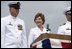 Mrs. Laura Bush smiles at Master Chief (SS) Mark K. Brooks, Command Master Chief, USS Texas, Saturday, September 9, 2006, after delivering remarks and giving the traditional command: "Man your ship and bring it to life!", during the Commissioning Ceremony in Galveston, Texas. Mrs. Bush participated in the christening of ship on July 31, 2004.