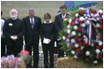 President George W. Bush and Laura Bush stand in silence after placing a wreath to commemorate the fifth anniversary of the September 11th attacks Monday, Sept. 11, 2006, in Shanksvillle, Pa., where United flight 93 crashed after the passengers fought against the terrorist hijackers.