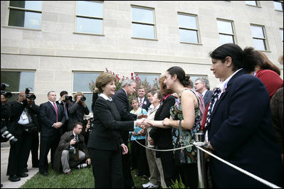 After placing a memorial wreath at the Pentagon, the President and Laura Bush greet audience members Monday, Sept. 11, 2006, during ceremonies marking the fifth anniversary of the September 11th attacks.