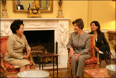 Mrs. Laura Bush talks with Mrs. Kwon Yang-Sook, wife of the President of South Korea, Thursday, September 14, 2006, during a coffee hosted by Mrs. Bush at the White House.