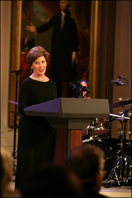 Mrs. Laura Bush welcomes guests to the East Room for entertainment Thursday night, Sept. 14, 2006, during the Thelonious Monk Institute of Jazz dinner at the White House.