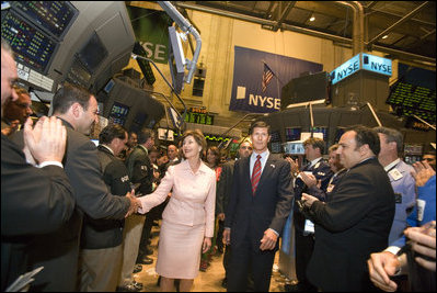 Mrs. Laura Bush is greeted on the floor of the New York Stock Exchange Monday, Sept. 18, 2006. Mrs. Bush visited the exchange with a delegation of entrepreneurs from around the world to participate in the close of trading and to ring the Closing Bell.