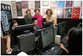 Mrs. Laura Bush and Mrs. Sehba Musharraf, wife of Pakistan's President Pervez Musharraf, right, watch a demonstration of the new cultural and arts website Thursday, Sept. 21, 2006, with students of Eleanor Roosevelt High School and teacher Elizabeth Putnam, far left, at The John F. Kennedy Center for the Performing Arts in Washington, D.C. The website is created by the Pakistan National Council the Arts and The Kennedy Center and is called, "Gift of the Indus: The Arts and Culture of Pakistan."