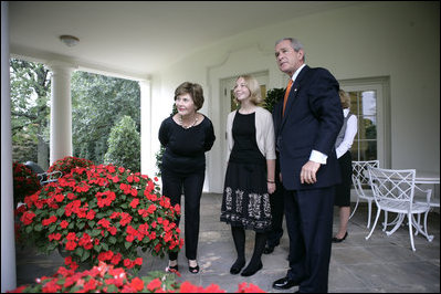 President George W. Bush and Mrs. Laura Bush are joined outside the Oval Office by the 2006 National Spelling Bee Champion, Kerry Close, as they call for Barney and Miss Beazley Friday, Sept. 22, 2006. The 9th grader from Spring Lake, N.J., won the competition by correctly spelling the word "Ursprache."