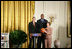 Mrs. Laura Bush stands with Ruth Riley, Detroit Shock WNBA player, left, and Brendan Haywood, Washington Wizards NBA player, after receiving the NBA Cares award Saturday, September, 30, 2006, during the National Book Festival opening ceremony in the East Room of the White House.