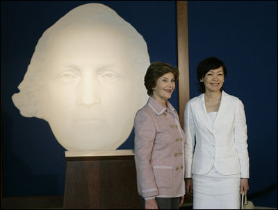 Mrs. Laura Bush and Mrs. Akie Abe, wife of Japanese Prime Minister Shinzo Abe, stand before a portrait of George Washington as they talk to members of the media, following a tour of the Mount Vernon Estate of George Washington Thursday, April 26, 2007, in Mount Vernon, Va.
