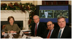 Mrs. Laura Bush is joined by Jim Jeffrey, Assistant to the President and Deputy National Security Advisor; Elliot Abrams, Deputy National Security Advisor for Global Democracy Strategy, and Dennis Wilder, Special Assistant to the President and Senior Director for East Asian Affairs, as she participates in a video conference on Burma in recognition of International Human Rights Day Monday, Dec. 10, 2007, in the Roosevelt Room of the White House. Speaking via video are U.S. Ambassador to Thailand Skip Boyce and Dr. Cynthia Maung, Founder and Director of the Mae Tao Clinic in Mae Sot,Thailand.