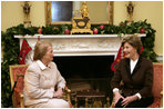 Mrs. Laura Bush enjoys a visit Tuesday morning, Dec. 11, 2007, with Mrs. Clio Napolitano, wife of President Giorgio Napolitano of Italy, during their visit to the White House.
