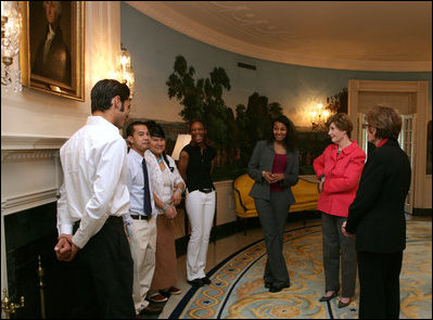 Mrs. Laura Bush talks with recipients of the 2007 Corps Member of the Year Award at the White House on Monday, Feb. 12, 2007. As part of the Helping America's Youth Initiative, The Corp Network engages disadvantaged youth in education, career preparation and life skill development and honors youth who become involved in their communities, overcome adversity, and become role models for America's young people. 