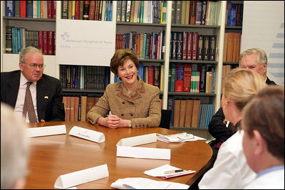 Mrs. Laura Bush and US Ambassador Craig Stapleton, left, participate in a roundtable discussion at the American Hospital of Paris Tuesday, Jan. 16, 2007, in Neuilly-on-Seine, France.