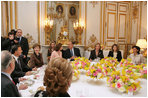 Mrs. Laura Bush attends a luncheon hosted by Madame Bernadette Chirac for the Conference on Missing and Exploited Children at the Elysee Palace in Paris Wednesday, Jan. 17, 2007. President Jacque Chirac of France is pictured in the center.