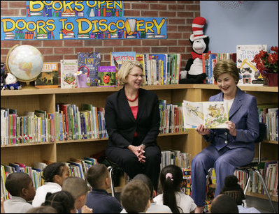 Mrs. Laura Bush, joined by U.S. Secretary of Education Margaret Spellings, reads to children at the Driggs School in Waterbury, Conn., Tuesday, July 24, 2007. Mrs. Bush also announced the 2007 Improving Literacy through School Libraries grants being awarded by the U.S. Department of Education. 