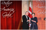Mrs. Laura Bush is presented with an award by Dick Moe, president of the National Trust for Historic Preservation, Tuesday evening, June 12, 2007 in Washington, D.C., in recognition of Mrs. Bush's sustained commitment and contributions to the preservation of America's heritage.