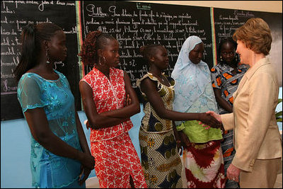 Mrs. Laura Bush meets Ambassador Girls' scholarship winners during a visit to Grand Medine Primary School Tuesday, June 26, 2007, in Dakar, Senegal. President Bush's Africa Education Initiative is working to provide 550,000 scholarships to girls throughout Africa by 2010. Pictured are, from left: Khady Diome, 15, of Diohine, Senegal; Fatou Djiby, 15, of Diakhao, Senegal; Christine Ndiaye, 14, of Diakhao, Senegal; Yamama Diop, 15, of Maroneme, Senegal; and Nango Dang, 16, of Thicky Serere, Senegal.