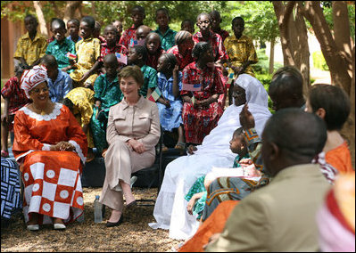 Mrs. Laura Bush and First Lady Toure Lobbo Traore of Mali, left, meet with students and teachers at the Nelson Mandela Primary School Complex Friday, June 29, 2007, in Bamako, Mali. The United States is partnering with African nations in the Africa Education Initiative, a $600 million dollar investment that will provide 550,000 scholarships to African children and train more than 900,000 teachers by 2010.