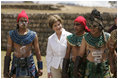 Mrs. Laura Bush poses with performers Monday, March 12, 2007, after a demonstration of a Mayan Ritual competition in Iximche, Guatemala. President and Mrs. Bush visited three Guatemalan villages during the morning hours before departing for Mexico, the last stop of their five-country, Latin American visit.