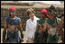 Mrs. Laura Bush poses with performers Monday, March 12, 2007, after a demonstration of a Mayan Ritual competition in Iximche, Guatemala. President and Mrs. Bush visited three Guatemalan villages during the morning hours before departing for Mexico, the last stop of their five-country, Latin American visit.