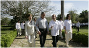 President George W. Bush and Mrs. Laura Bush walk with Mexico's President Felipe Calderon and Mrs. Margarita Zavala upon their arrival Tuesday, March 13, 2007, to Hacienda Temozon in Temozon Sur, Mexico.