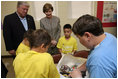 Mrs. Laura Bush visits with Taconi Elementary fifth graders Friday, Nov. 2, 2007, in Ocean Springs, Miss., prior to delivering remarks during the announcement of the Coastal Ecosystem Learning Center Designation and Marine Debris Initiative. The Marine Debris Initiative focuses on identifying, reducing and preventing debris in the marine environment through public and private partnerships, education and international cooperation.
