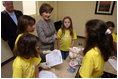Mrs. Laura Bush visits with Taconi Elementary fifth graders Friday, Nov. 2, 2007, in Ocean Springs, Miss., prior to delivering remarks during the announcement of the Coastal Ecosystem Learning Center Designation and Marine Debris Initiative. The students worked with Gulf Coast Research Laboratory graduate students from the University of Southern Mississippi to learn the importance of prevention, reducing, and removal of ocean and coastal debris. 