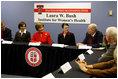Mrs. Laura Bush listens to Chancellor Kent Hance during a roundtable discussion with members of Texas Tech University, TTU Health and Science Center, and the Laura W. Bush Institute for Women's Health Wednesday, Nov. 7, 2007, in Amarillo, Texas. Mrs. Bush is sitting with, from left, Dr. John Baldwin, Erin Thurston, and Dr. Marjorie Jenkins.