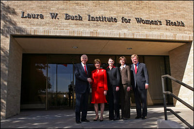 Mrs. Bush shakes hands with Chancellor Kent Hance, Texas Tech University System, as she stands with Dr. Marjorie Jenkins, Erin Thurston and Dr. John Baldwin in front of the Laura W. Bush Institute for Women's Health at TTU, Amarillo Campus Wednesday, Nov. 7, 2007, in Amarillo, Texas.