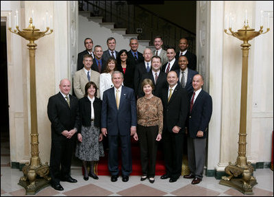 President George W. Bush and Mrs. Laura Bush stand with the crew members of the Space Shuttle Discovery (STS-116), Space Shuttle Atlantis (STS-117), Space Shuttle Endeavour (STS-118), and International Space Station Expeditions 14 and 15, Wednesday, Nov. 14, 2007 in the Grand Foyer of the White House. Since December 2006, NASA astronauts have journeyed more than 15 million miles in space and conducted more than a dozen space walks.