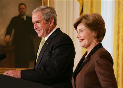 President George W. Bush is joined by Mrs. Laura Bush in the East Room of the White House, Friday, Nov. 16, 2007, in an address to invited guests in celebration of National Adoption Day. President Bush, in speaking to parents and children, said he was "So thankful that the parents and children here today have found the gift of one another. And I encourage our citizens across the land to explore adoption, look into the joys of adoption, and provide love for somebody who needs it."